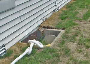 old concrete window well of a Utica crawl space