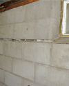 Severely buckling foundation walls in a home in Cortland in need of repairs.