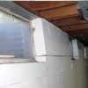 A foundation showing severe inward buckling along the windows in a Auburn home.