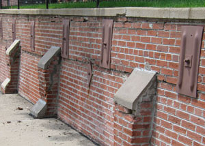 Rusted wall plate anchors in a retaining wall repair in Ogdensburg.