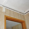 The ceiling and wall separating as the wall sinks with the slab floor in a Baldwinsville home