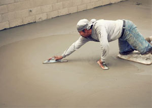 smoothing out the grout in a slab releveling project in Rochester