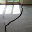 a huge crack in a concrete slab floor in Utica