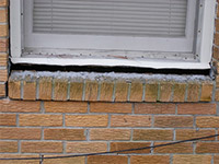 A window sill cracking and separating from the foundation wall in a Vestal home.
