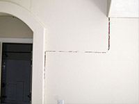 Drywall cracking due to foundation settlement in Cortland