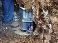 Securing a foundation footing bracket for a foundation repair system in Watertown.