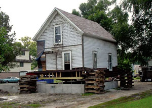 A severely damaged home foundation that is undergoing replacement in Geneva.