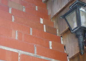 a repaired chimney in Oswego that had shown serious foundation damage and was repaired with a helical pier system.