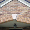 Major tuckpointing on a home archway over a door, with tuckpointing several inches wide that has failed on a Syracuse home