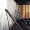Temporary foundation wall supports stabilizing a Liverpool home