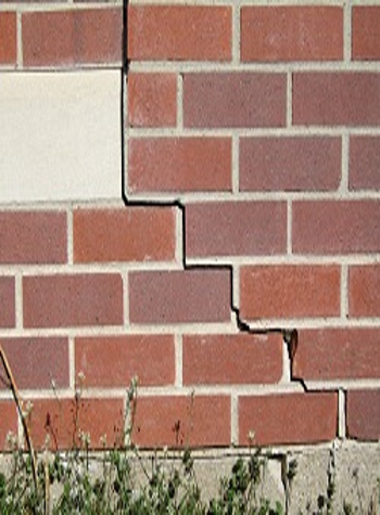 photo of a rotating foundation wall with cracks in Corning