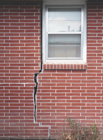 severe foundation wall cracks along a window in Geneva
