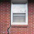 foundation cracks along a window in Clay