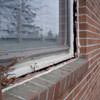 A gap in a window along the outer wall due to foundation settlement of a Endicott home.