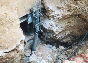 a bent, failed foundation push pier installed in Utica.