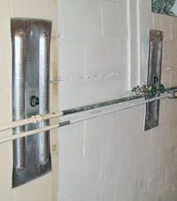 A foundation wall anchor system used to repair a basement wall in Fulton