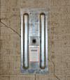A fully exposed wall anchor plate installed along a Massena foundation wall