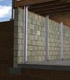 I-beam foundation wall supports installed in a Potsdam basement.
