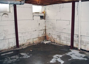 A failed, rusty i-beam foundation wall system installed in Corning.