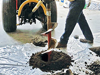 Digging the hole used for wall anchor installation in Vestal.