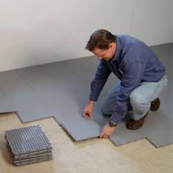 basement subfloor tiles being installed by a contractor in Potsdam