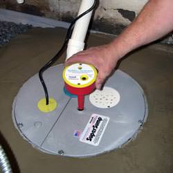 A newly installed sump pump system in a basement in Fulton